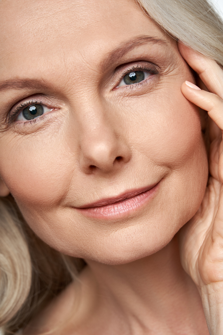 50 Years Old Woman Looking at Camera. anti Age Skin Care. Face Close up View